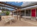 Spacious covered patio with outdoor seating area, perfect for relaxing and entertaining at 8107 E Butte St, Mesa, AZ 85207