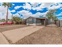 Charming home with mature landscaping, private gated yard, and long driveway at 8107 E Butte St, Mesa, AZ 85207
