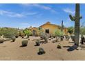 Expansive desert home featuring beautiful cacti and desert landscaping at 9290 E Thompson Peak Pkwy # 409, Scottsdale, AZ 85255