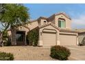 Charming home featuring a three-car garage and mature landscaping at 13993 N 102Nd St, Scottsdale, AZ 85260