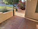 Lovely tiled patio offers views of the well-maintained community with lush landscaping and a sparkling pool at 14300 W Bell Rd # 57, Surprise, AZ 85374