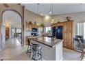 Bright kitchen features a center island, pendant lighting, and ample cabinetry at 16230 E Glenpoint Dr, Fountain Hills, AZ 85268