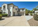 Large driveway leading to a three-car garage and a basketball hoop at 1890 E Sagittarius Pl, Chandler, AZ 85249