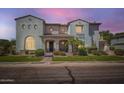 Two-story house featuring a quaint front entrance, desert landscaping, and an elegant balcony at 1890 E Sagittarius Pl, Chandler, AZ 85249