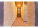 Inviting entryway with a charming brick walkway and a welcoming front door at 19873 W San Juan Ave, Litchfield Park, AZ 85340