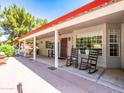 Charming covered patio with comfortable seating and a cozy atmosphere at 25829 S Mandarin Dr, Queen Creek, AZ 85142