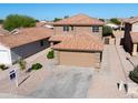 Aerial view of a two-story home with a two-car garage and desert landscaping at 272 S 228Th Ln, Buckeye, AZ 85326