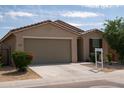 Attractive one-story house with a roomy garage, neat front garden, and a traditional tiled roof at 2723 W Apollo Rd, Phoenix, AZ 85041