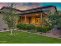Inviting front porch with decorative columns and lush landscaping at 3929 E Bloomfield Pkwy, Gilbert, AZ 85296