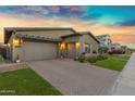 Spacious three-car garage with brick driveway and well-maintained lawn at 3929 E Bloomfield Pkwy, Gilbert, AZ 85296