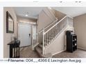 Inviting foyer featuring a staircase with white banisters and an abundance of natural light at 4366 E Lexington Ave, Gilbert, AZ 85234