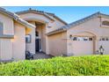 Charming single-story home featuring a well-manicured lawn, desert landscaping, and a spacious three-car garage at 4493 E Desert Sands Dr, Chandler, AZ 85249