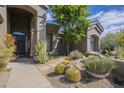 Charming front yard with desert landscaping and a neutral color palette home at 7486 E Bajada Rd, Scottsdale, AZ 85266
