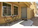 Welcoming entrance with a cozy outdoor seating arrangement, perfect for enjoying the neighborhood ambiance at 7722 W Pipestone Pl, Phoenix, AZ 85035