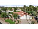 Expansive overhead view of a neighborhood featuring mature trees and grass at 8943 N 80Th Pl, Scottsdale, AZ 85258