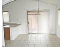 Bright dining area with tile flooring, and glass sliding door at 10752 W Rio Vista Ln, Avondale, AZ 85323