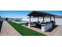 Lush backyard with outdoor seating, entertainment area, pool, mountain views, and privacy for relaxation at 10910 N Thunderbird Rd, Maricopa, AZ 85139