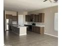 Spacious kitchen features stainless steel appliances, an island, ample cabinet space, and recessed lighting at 1255 N Arizona Ave # 1216, Chandler, AZ 85225