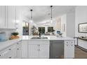 Open-concept kitchen featuring a breakfast bar, stainless steel appliances, and seamless flow to living area at 14945 N 102Nd St, Scottsdale, AZ 85255