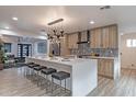 Open kitchen featuring a large island with seating and modern stainless steel appliances at 1539 W Puget Ave, Phoenix, AZ 85021