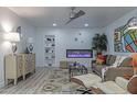 Comfortable living room features a modern fireplace, stylish decor, and ample seating at 1539 W Puget Ave, Phoenix, AZ 85021