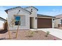 Charming home featuring a low-maintenance landscape and a two-car garage at 23404 W Burton Ave, Buckeye, AZ 85326