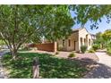 Landscaped front yard with a charming walkway leading to a well-maintained, single story home at 2554 E Vermont Dr, Gilbert, AZ 85295