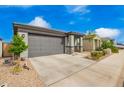 Lovely single-story home featuring a well-maintained front yard, and a two-car garage with a paved driveway at 4701 S Siphon Draw Rd, Apache Junction, AZ 85119