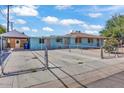 This home has covered parking and a fenced yard in this exterior shot at 6447 W Piccadilly Rd, Phoenix, AZ 85033