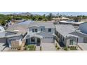 Aerial view of a modern home in a neighborhood with palm trees and mountain views at 6743 N 9Th Dr, Phoenix, AZ 85013