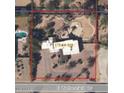 An aerial view of the property outlined in red, displaying the roof and uniquely designed outdoor pool in desert landscaping at 6936 E Wethersfield Rd, Scottsdale, AZ 85254