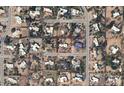 Aerial view of the neighborhood, showing the property outlined in red with nearby houses, landscaping, and street layout at 6936 E Wethersfield Rd, Scottsdale, AZ 85254