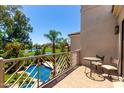 Balcony overlooking the golf course and pool, providing a serene outdoor living space and stunning views at 7475 E Gainey Ranch Rd # 4, Scottsdale, AZ 85258