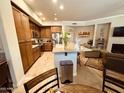 Spacious kitchen open to the living area with granite countertops and stainless steel appliances at 7601 E Indian Bend Rd # 1049, Scottsdale, AZ 85250
