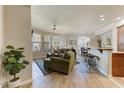 Bright living room featuring tiled floor, stylish furniture, ceiling fan, and large windows offering plenty of light at 7601 E Indian Bend Rd # 1049, Scottsdale, AZ 85250