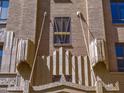 Close-up of art deco architectural detail on the exterior of this tan brick building at 114 W Adams St # 907, Phoenix, AZ 85003