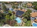 Areal view of the property showcasing the pool, patio, and solar panels at 12537 N 76Th Pl, Scottsdale, AZ 85260