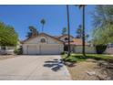 Charming home featuring a three car garage, and lush landscaping at 12537 N 76Th Pl, Scottsdale, AZ 85260