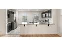 Modern kitchen features stainless steel appliances, granite countertops, and bright natural light at 1255 N Banning --, Mesa, AZ 85205