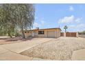 Single story home featuring a low-maintenance desert landscape and a one-car garage at 1526 W Huntington Dr, Tempe, AZ 85282