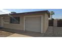 Detached single-car garage providing secure parking and additional storage space, close to main house at 1526 W Huntington Dr, Tempe, AZ 85282