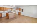 Bright kitchen featuring a functional island and stainless steel appliances at 1526 W Huntington Dr, Tempe, AZ 85282