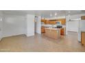 Open kitchen layout with a central island and ample cabinet space at 1526 W Huntington Dr, Tempe, AZ 85282