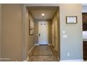 Inviting entryway featuring tile flooring and neutral walls at 16913 W Holly St, Goodyear, AZ 85395
