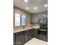 Modern kitchen with stainless steel appliances, sleek countertops, and ample cabinet space at 19400 N Westbrook Pkwy # 216, Peoria, AZ 85382