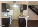 Updated kitchen boasts modern appliances, sleek countertops, and plenty of cabinet space at 2133 W Turney Ave # C88, Phoenix, AZ 85015