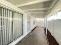 Enclosed patio with sliding glass doors offers privacy and space for outdoor relaxation at 2133 W Turney Ave # C88, Phoenix, AZ 85015