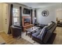 Comfortable living room with a brick fireplace and stylish furnishings at 3511 E Baseline Rd # 1104, Phoenix, AZ 85042