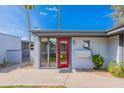 Striking red front door with desert landscaping, stylish lighting, and well-kept facade at 4206 N 38Th St # 1, Phoenix, AZ 85018