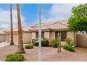 Charming single-story home featuring a well-maintained yard, beautiful landscaping, and a two-car garage at 4292 E Terrace Ave, Gilbert, AZ 85234
